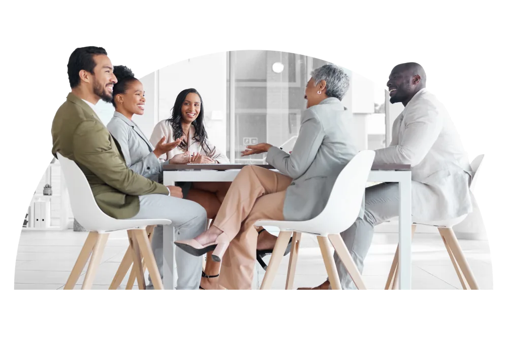Group of people sitting around a table at sunrise