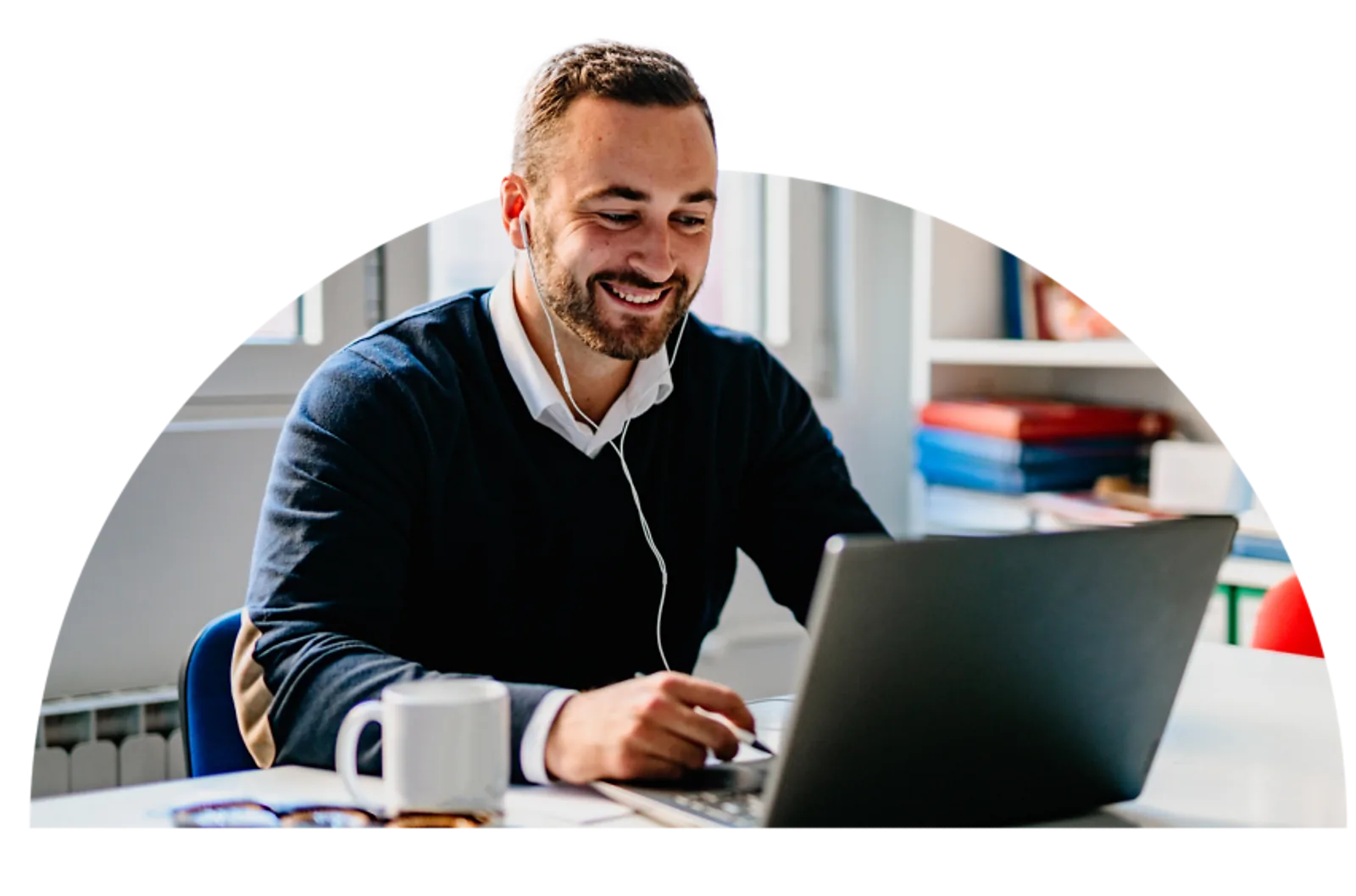 Man watching on-demand training content on a laptop